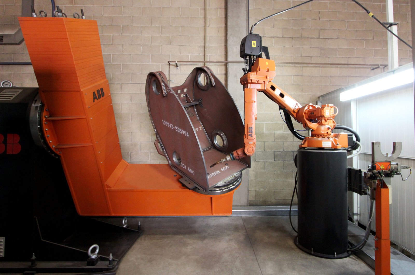 Robotic welded fabrication of industrial attachment component